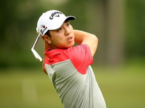 Sangmoon Bae of South Korea tees off on the eighth hole during the final round of the Greenbrier Classic held at The Old White TPC on July 5, 2015 in White Sulphur Springs, West Virginia. (Darren Carroll/Getty Images/AFP)