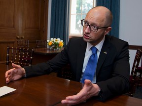 Ukrainian Prime Minister Arseniy Yatsenyuk gestures during an interview with The Associated Press following the first U.S.-Ukraine Business Forum co-hosted by the U.S. Chamber of Commerce and the Commerce Department, Monday, July 13, 2015, in Washington.   (AP Photo/Manuel Balce Ceneta)