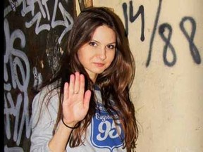 Olga Kuzkova is pictured in this undated photo from Twitter. A runner-up in a Russian beauty contest was stripped of her “Miss Charming” title after a search on social media revealed — quite clearly — she’s a raging, hard-core Nazi, with photos of her heil-Hitlering in front of 14/88 graffiti and posing with her boyfriend in adorable matching white power-symbol emblazoned T-shirts.  Handout/Postmedia Network