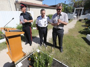 On Wednesday, July 22, 2015, Winnipeg police released a report that showed no significant increase or decrease in crime.  Superintendent Danny Smyth (middle) made the announcement.  Smyth is standing with city councillor Ross Eadie (right) and constable Eric Hofley.