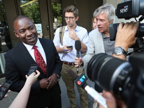 Lawyer Michael Smith talks to the media in front of the Ottawa courthouse in Ottawa Wednesday July 22, 2015. Smith is the defence lawyer for Gino Langevin who was arrested Tuesday for killing Gail Fawcett on Anna Ave. in Ottawa.  Tony Caldwell/Ottawa Sun/Postmedia Network