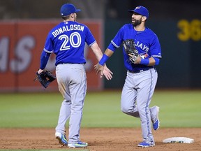 Blue Jays’ Josh Donaldson (left) is embracing his return to Oakland, where he used to play. Meanwhile, teammate Jose Bautista made it six consecutive seasons with 20 home runs following his dinger in the series-opener on Tuesday night. (AFP/PHOTO)