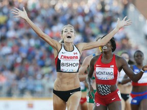 Canada’s Melissa Bishop celebrates after winning gold in the women’s 800 metres on Wednesday night. (Stan Behal/Toronto Sun)