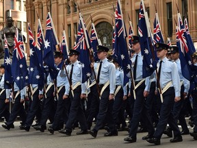 Royal Australian Air Force Cadets march along George Street during the Anzac Day parade in Sydney on April 25, 2015. Record numbers of Australians and New Zealanders turned out on April 25 to mark the centenary of the Gallipoli landings amid tight security, a formative event that helped forge their identities as independent nations. (AFP/Saeed KHAN)