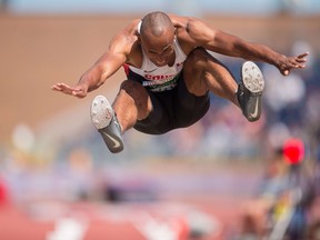 Damian Warner of London flies toward the pit during the Pan Am Games decathlon long jump at CIBC Athletics Stadium in Toronto on Wednesday. (Photo by AFP)