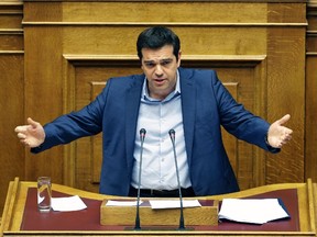 Greece's Prime Minister Alexis Tsipras delivers a speech during an emergency parliament session in Athens, Thursday, July 23, 2015. (AP/Thanassis Stavrakis)