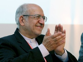 Mohammad Reza Nematzadeh, Minister of Industry, Mine and Trade of Iran applauds during the "Iran-EU conference, Trade and Investment" forum in Vienna, Austria, Thursday, July 23, 2015. Less than 10 days after signing its nuclear deal, Iran formally threw open its doors Thursday to European Union companies, eager to do business - and dozens of firms answered the call. (AP Photo/Ronald Zak)