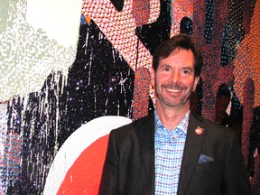 Artist John Kissick poses with his painting, The Chatham-Remix, in the Thames Art Gallery. The artist “re-mixed” the work while in residency at the gallery. The painting is part of the gallery’s current exhibit of “Boom Bits,” a five-year retrospective of Kissick’s work.