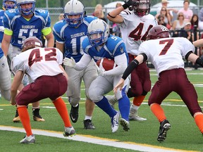 John Pavacic, middle, of the Sudbury Gladiators, runs in for a touchdown against the Nipissing Wild during Ontario Football Conference varsity action at James Jerome Sports Complex in Sudbury, Ont. on Saturday July 18, 2015.