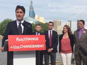 Liberal Leader Justin Trudeau, alongside Manitoba Liberal candidates, talks to reporters in Winnipeg, Thursday, July 23, 2015. Trudeau rejected any suggestion of a coalition with the New Democrats after NDP MP Nathan Cullen suggested a coalition to oust the Conservatives would be welcomed by his party. THE CANADIAN PRESS/Steve Lambert