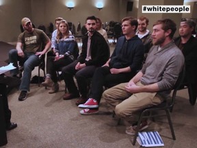 Filmmaker Jose Antonio Vargas (L) and a group of white individuals. 

(YouTube/MTV)