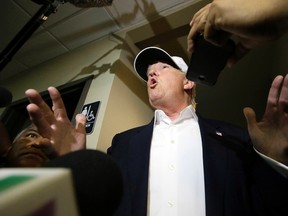 Republican presidential hopeful Donald Trump speaks to reporters after arriving for a visit to the U.S. Mexico border in Laredo, Texas, Thursday, July 23, 2015. (AP Photo/LM Otero)