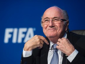 FIFA president Sepp Blatter smiles during a news conference at FIFA headquarters in Zurich on Monday. Blatter arrived in Russia on Thursday for Friday's 2018 World Cup qualifying draw. (Ennio Leanza/Keystone via AP)
