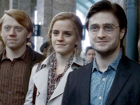 (L to R): Rupert Grint, Emma Watson, and Daniel Radcliffe as Ron Weasley, Hermoine Granger, and Harry Potter in the Deathly Hallows Part II.

(WarnerBros)