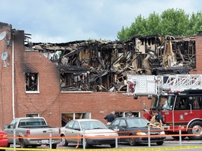 Firefighters are on the scene of a fire in Drummondville, Que., Thursday, July 23, 2015. (THE CANADIAN PRESS/Ryan Remiorz)