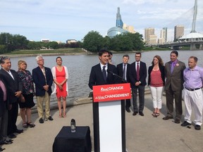 Liberal Leader Justin Trudeau, alongside Manitoba Liberal candidates, talks to reporters in Winnipeg, Thursday, July 23, 2015. (THE CANADIAN PRESS/Steve Lambert)