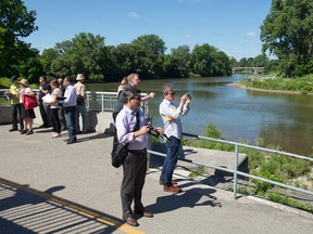 Finalists in the Back to the River design contest check out the Thames River from Ivey Park during fact-finding visit to London this week. (Free Press file)