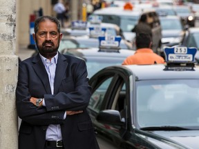 Amrik Singh, president of the taxi union, poses for a photo following meetings with city of Ottawa officials. Monday July 6, 2015. Errol McGihon/Ottawa Sun/Postmedia Network
