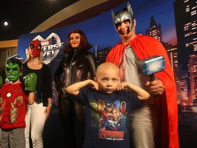 Jacob Trudel (front), 5, is surrounded by brother Joshua (Hulk), 8, mother Jennifer (Spider-Man), Black Widow and father John (Thor) at MTS Centre. (KEVIN KING/Winnipeg Sun)