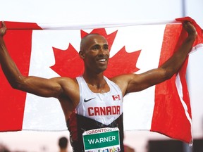 Damian Warner celebrates after winning the gold medal in the men’s decathlon on Thursday. (STAN BEHAL/Toronto Sun)