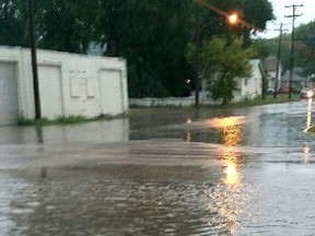 About 76 millimetres of rain fell in Portage la Prairie during Thursday night's storm. Pictured here is Lorne Avenue in Portage. (TARA-MARIE HALL TWITTER PHOTO)