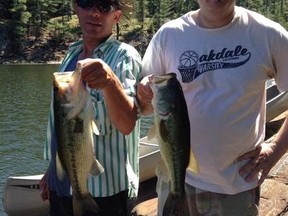 Little Current's Jeff Crowell (left) and Sudbury's Bob Lamothe show a pair of midsummer largemouth bass after a doubleheader. Sudbury Star columnist John Vance gives some midsummer fishing tips in this week's Outdoor Trails column.