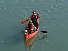 People paddle down the North Saskatchewan River.