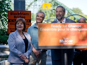 NDP leader Tom Mulcair is joined at the podium by NDP London Fanshawe MP Irene Mathyssen, London West NDP candidate Matthew Rowlinson, and London North Centre NDP candidate German Gutierrez, right, as Mulcair talks to the media during a stop in London, Ont. on Friday July 24, 2015. (CRAIG GLOVER, The London Free Press)