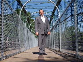NDP leader Tom Mulcair poses for a photo on the Blackfriars Bridge during a stop in London, Ont. on Friday July 24, 2015. Craig Glover/The London Free Press/Postmedia Network