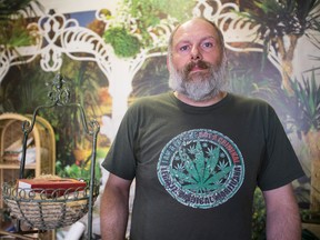 MACROS president Aaron Bott poses for a photo at the former medical marijuana dispensary at 4121 118 Avenue in Edmonton, Alta., on Friday July 24, 2015. The dispensary was closed by police. Ian Kucerak/Edmonton Sun/Postmedia Network