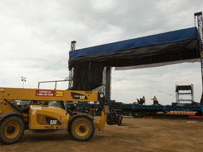 Crews take down the main stage at the Big Valley Jamboree 2014 site in Camrose, Alta., on Monday, Aug. 4, 2014. Ian Kucerak/Edmonton Sun