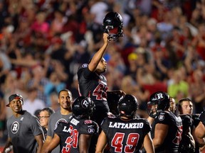 Ottawa Redblacks' kicker Delbert Alvarado is hoisted up by his teammates after kicking the gamewinning field goal in overtime against the Calgary Stampeders on Friday, July 24, 2015. Despite hitting that winner, Alvarado was released last week - he had missed two field goals earlier in the game. 
THE CANADIAN PRESS/Sean Kilpatrick