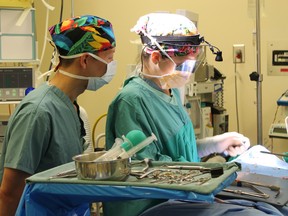 Dr. Christa Favot (right), performs HSN’s first first cadaveric nerve graft on a patient with a benign tumour (neuroma) on one of the nerves in the jaw, under the supervision of visiting surgeon Dr. David Lam (left) of the University of Toronto.