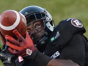 Ottawa RedBlacks' Ernest Jackson makes a touchdown catch against the Calgary Stampeders during first quarter CFL football action in Ottawa on Friday, July 24, 2015. THE CANADIAN PRESS/Sean Kilpatrick