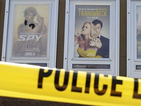 A poster of  of Amy Schumer's movie "Trainwreck" (C) is seen on July 25, 2015 outside The Grand Theatre in Lafayette, La. (AFP PHOTO/YURI GRIPAS)