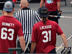 Calgary Flames rookie Sam Bennett and Canadian Women's National Team goalie and member of the CWHL Boston Blades Genevieve Lacasse return to second annual The Brass Pub Charity Ball Hockey Tournament in Kingston, Ont. on Saturday July 25, 2015. Steph Crosier/Kingston Whig-Standard/Postmedia Network