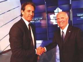 Leafs president Brendan Shanahan (left) shakes hands with new GM Lou Lamoriello this week. (MICHAEL PEAKE/Toronto Sun)