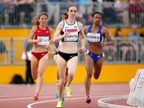 Jul 25, 2015; Toronto, Ontario, CAN; Canada's Nicole Sifuentes from Winnipeg leads Muriel Coneo of Colombia and Cory McGee of the United States in the women's 1500m final during the 2015 Pan Am Games at CIBC Pan Am Athletics Stadium. Mandatory Credit: Erich Schlegel-USA TODAY Sports