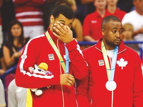 Canada’s Jamal Murray fights back tears after accepting his silver medal following yesterday’s loss to Brazil. (CP)