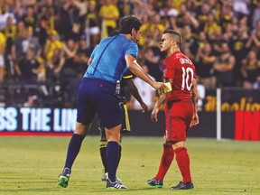 Toronto FC’s Sebastian Giovinco gets face-to-face with referee Fotis Bazakos during last night’s game in Columbus. Giovinco scored one goal in the 3-3 draw. (USA TODAY SPORTS)