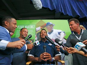 Pedro Martinez chats with members of the media during a news conference yesterday in Cooperstown, N.Y. Martinez will be officially inducted to the Hall of Fame this afternoon. (AP)