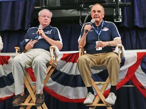 Tom Gage (left), winner of the J.G. Taylor Spink Award, and Ford C. Frick Award recipient Dick Enberg chat with fellow media members during a Hall of Fame news conference at the Clark Sports Pavilion in Cooperstown, N.Y., yesterday. (AP)