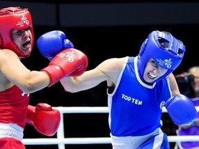 Mandy Bujold (right) fights Marlen Esparza at the Pan Am Games. (The Canadian Press)