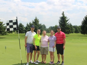 Jeff Romkey, Kate Romkey, Lorna Larsen, Robyn MacDougall and Kian MacDougall (left to right) gather after the 17th hole at the Fore for Shan Golf Tournament. Robyn was one of Shanna's best friends and is now a board member. (MEGAN STACEY/Sentinel-Review)