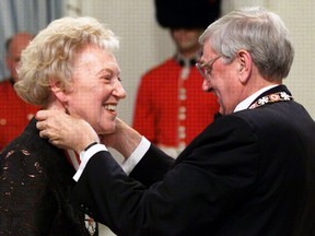 Flora MacDonald is promoted as a companion in the Order of Canada by Governor General Romeo LeBlanc in Ottawa, Wednesday, April 14, 1999. MacDonald, who served as a senior cabinet member in two Conservative federal governments and made a run for the party's leadership in 1976, has died. 
THE CANADIAN PRESS FILE