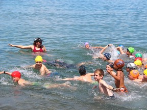 Haley Walker, a competitor in Saturday's Bluewater Triathlon, guides the nine-and-under competitors in Sunday's Ironkid event.
PHOTOGRAPH TAKEN AT SARNIA ONTARIO ON SUNDAY, JULY 26, 2015. (NEIL BOWEN/ SARNIA OBSERVER/ POSTMEDIA NETWORK)