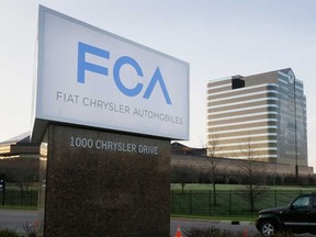 In this Tuesday, May 6, 2014, file photo, the Fiat Chrysler Automobiles sign is seen after being unveiled at Chrysler World Headquarters in Auburn Hills, Mich. The U.S. government will fine Fiat Chrysler a record $105 million for violating safety laws in a series of recalls, a person briefed on the matter says. The National Highway Traffic Safety Administration will reveal the fine on Monday, July 27, 2015, says the person who didn't want to be identified because the official announcement hasn't been made. (AP Photo/Carlos Osorio, File)