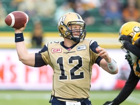 Winnipeg Blue Bombers quarterback Brian Brohm (12) makes the throw against the Edmonton Eskimos during second half CFL action in Edmonton, Alta., on Saturday, July 25, 2015.