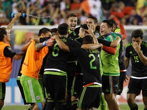 Mexico players celebrate after winning the CONCACAF Gold Cup championship soccer match against Jamaica, Sunday, July 26, 2015, in Philadelphia. (AP Photo/Matt Rourke)