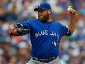 Blue Jays starter Mark Buehrle delivers a pitch against the Seattle Mariners on July 26, 2015. “I didn’t feel like it was my best game,” he said after allowing three runs in 5.2 innings. (OTTO GREULE JR./Getty Images/AFP)